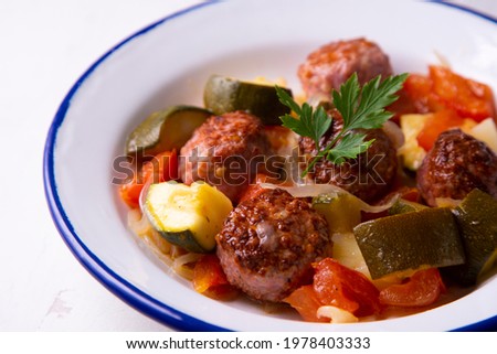 Meatballs with roasted vegetables. Traditional Spanish tapa.