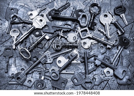 A composition of many old, rusty keys of different shapes. Background image, texture