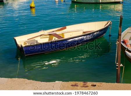 Blue fishing boat on water
