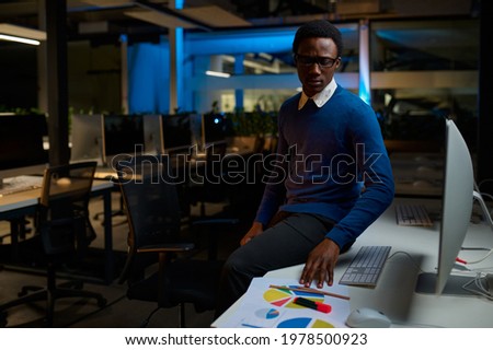 Man in glasses works on computer, office lifestyle