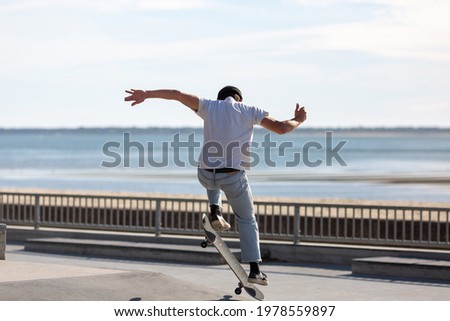 young man skateboarding in a skatepark