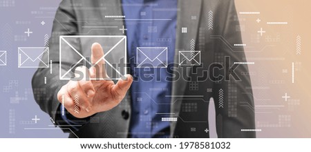 Communication concept with man touching digital screen with envelope signs