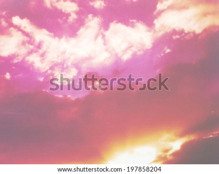 A low contrast filtered image of a dramatic sunset cloudscape