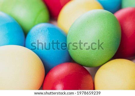 multicolored Easter eggs close-up top view, selective focus, tinted image