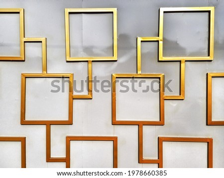 Beautiful golden yellow checkered pattern on a white wall.