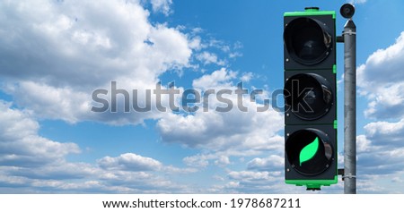 Traffic light with green leaf symbol. Clean mobility concept Royalty-Free Stock Photo #1978687211