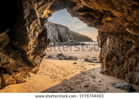 Absolutely stunning landscape images of Holywell Bay beach in Cornwall UK during golden hojur sunset in Spring Royalty-Free Stock Photo #1978744403