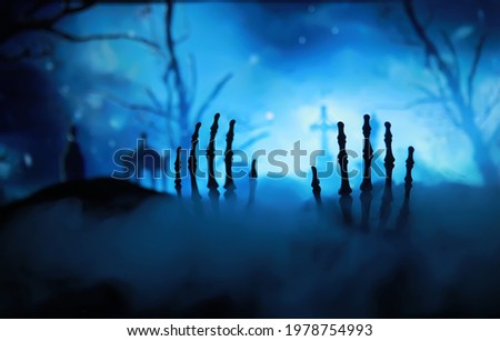 Skeleton Zombie Hand Rising Out Of A GraveYard - Halloween. Mysterious magic ball predictions and smoke on dark scene. Fortune teller, mind power, prediction concept. mysterious background

