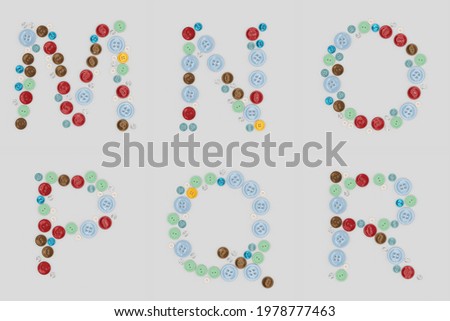Alphabet from sewing buttons . Letter from buttons. Font from buttons. On a white background. 3D