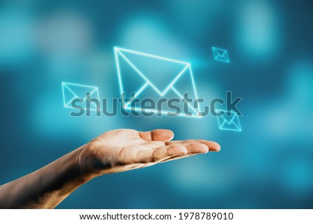 Notification message concept with man palm and digital envelope above