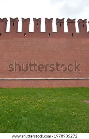 Background. Old Brick wall painted with red paint. Part of the Kremlin red wall. Russia, Moscow.