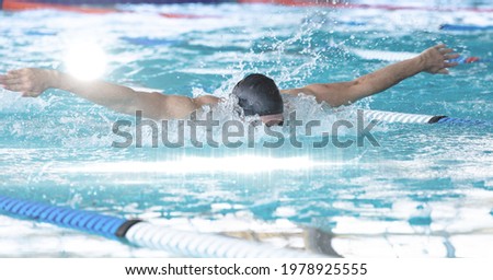 Composition of man swimming in swimming pool. sport, fitness and active lifestyle concept digitally generated image.