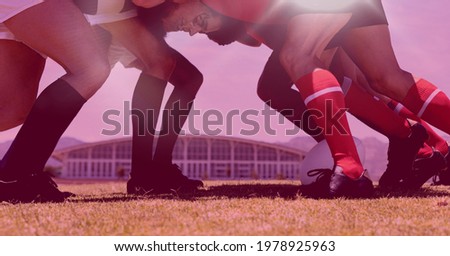 Composition of rugby players in scrum with purple background. sport, fitness and active lifestyle concept digitally generated image.