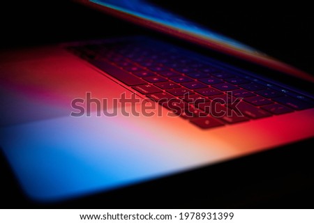 Multicolour glow on a  Laptop Royalty-Free Stock Photo #1978931399