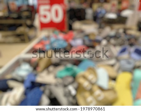 Defocused Abstract blurred background of sandals or footwear Department store with  discount sign. Sale concept. Shopping sales sign with percentage discount. Modern trade, use for background. 


