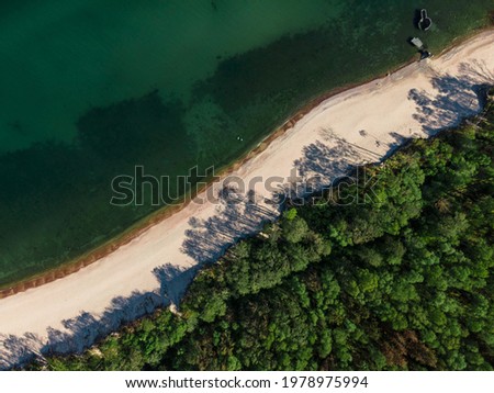 Aerial view of sandy beach, sea and forest on Baltic sea on Curonian spit. top view. shot from drone. Landscape photography