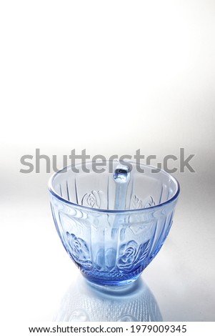 photo of a blue and white cup