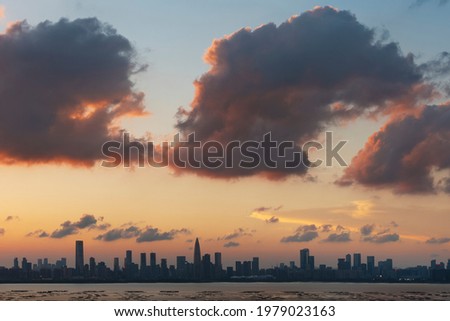 Panorama of skyline of Shenzhen city, China under sunset. Viewed from Hong Kong border
