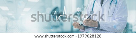 Doctor hand working with report information,concept of emergency treatment and medical services,healthcare,diagram,medical examination analysis report,medicine technology network,web banner header