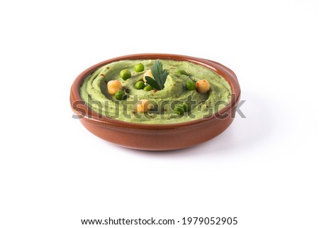 Green pea hummus isolated on white background