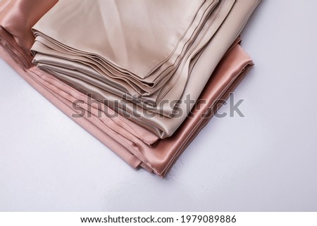 Silk pillow cover, folded silk cushion case Royalty-Free Stock Photo #1979089886