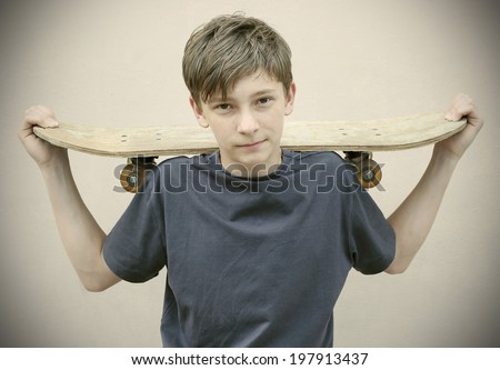 boy with Skateboard wearing Vintage photos retro style