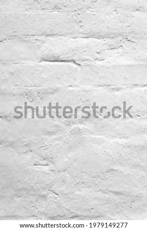 White brick wall. Old rustic brick wall covered with whitewash. Natural creative texture for editing and design. Free space.