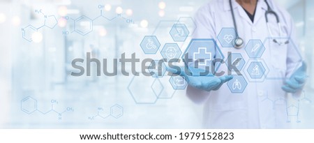 Health insurance, healthcare and medicine, medical technology, telemedicine, virtual hospital concept. Medical doctor with health icons on virtual screen with blurred hospital background