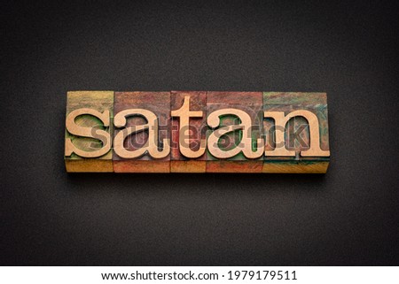 satan word abstract in vintage letterpress wood type, religious concept