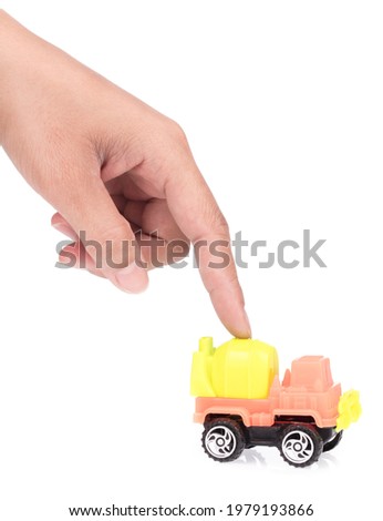 Hand with toy truck Concrete mixe isolated over white background