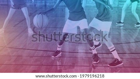 Composition of group of fit basketball players playing match over light blur. sport, fitness and active lifestyle concept digitally generated image.