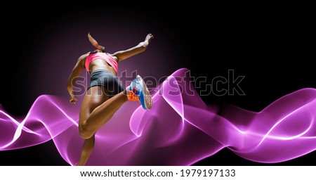 Composition of athletic woman running on black background. sport, fitness and active lifestyle concept digitally generated image.