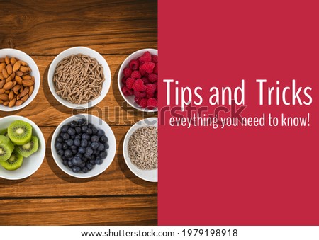 Composition of tips and tricks text with bowls of food background. advice and cookery concept digitally generated image.