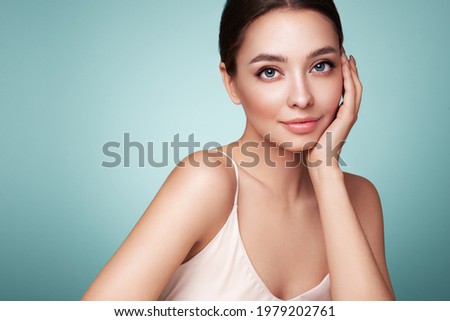 Portrait beautiful young woman with clean fresh skin. Model with healthy skin, close up portrait. Cosmetology, beauty and spa Royalty-Free Stock Photo #1979202761