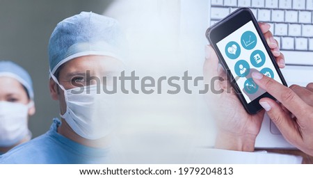 Composition of diverse group of doctors and smartphone with motion blur. medical science and technology concept digitally generated image.