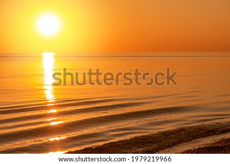 Golden dawn on the sea or ocean. Summer backgroundSummer morning at sea.