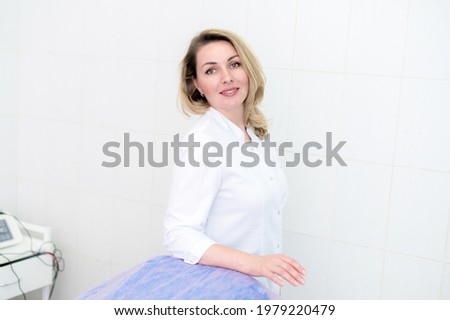 Portrait of beautiful female doctor looking at camera