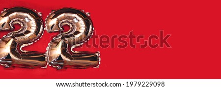 Silver Foil Balloon Number 22 On red  Background, Happy birthday balloon banner. Holiday decoration