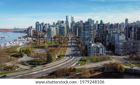 Downtown Vancouver Skyline from bottom of Georgia Street above Lost Lagoon with Burrard Inlet in frame