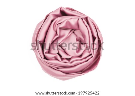 Pink silk scarf is folded like a rose isolated on white background Royalty-Free Stock Photo #197925422
