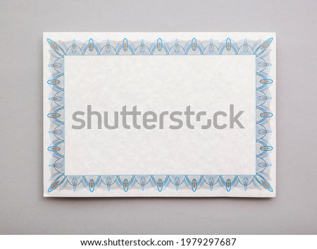Blank achievement certificate document template with an ornate border Royalty-Free Stock Photo #1979297687