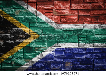 National flag of South African Republic on stone  wall background.The concept of national pride and symbol of the country. Flag  banner on  stone texture background.