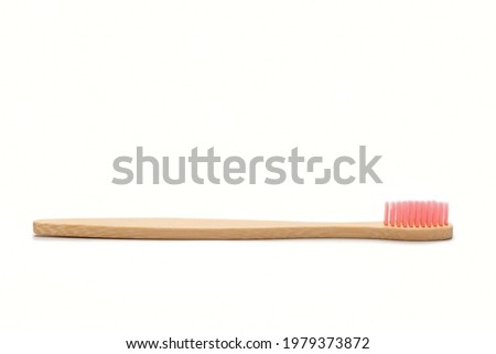 Bamboo toothbrush isolated on a white background. Top view. 
