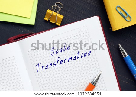  Financial concept meaning Scale Transformation with sign on the sheet.

