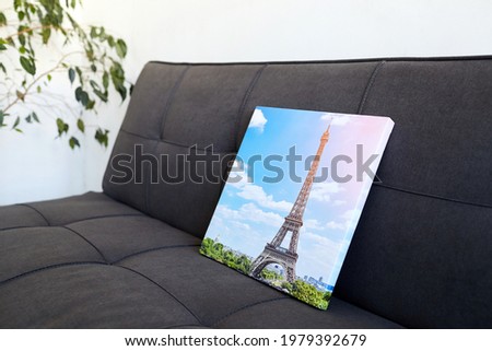 Photo canvas print stretched on frame with gallery wrap, photography with Eiffel Tower, photo printed on canvas in white wall room with green houseplant and sofa