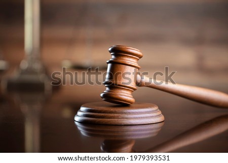 Mallet of the judge. Wooden background. Law and justice concept.