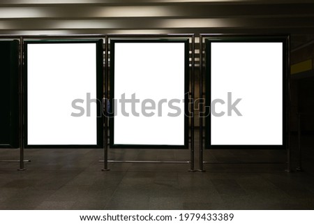 Front view of three empty white billboard screens at the metro station. Mock up. Blank advertising billboards in the subway 
 Royalty-Free Stock Photo #1979433389