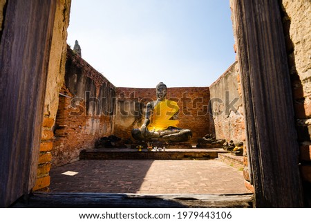 Ayutthaya : Buddha statue at Wat Worachettharam (Wat Worachet in the island) is an important temple of Ayutthaya province, Thailand. Temple in Ayutthaya historical park. UNESCO world heritage.