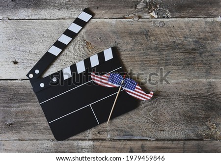 American flag with 
Clapperboard on wooden background