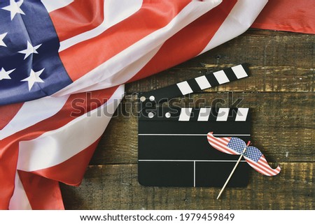 American flag with 
Clapperboard on wooden background